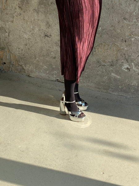 mirrored silver platform heels